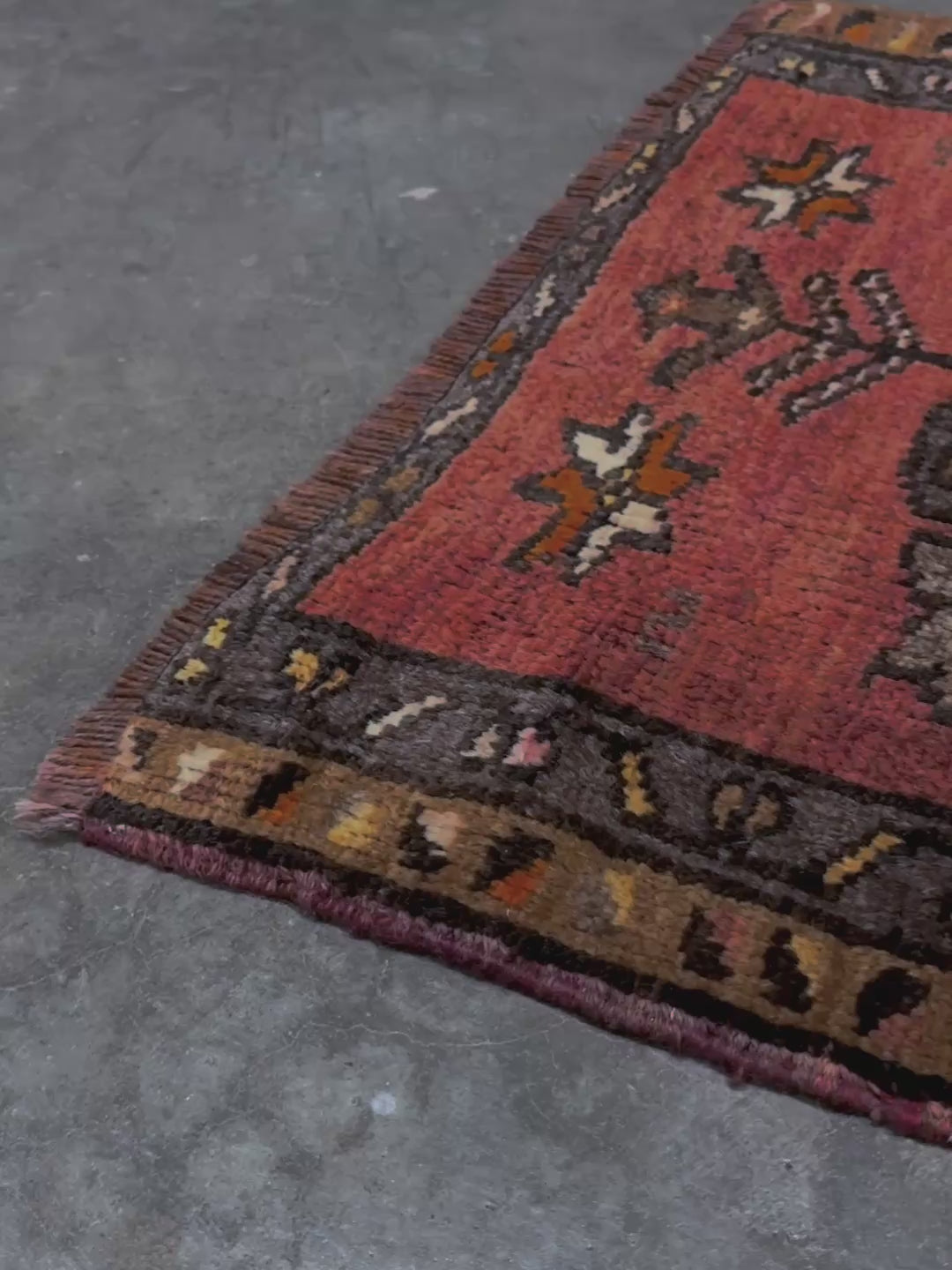 Vintage Turkish Yastik rug with a terracotta field, olive-brown medallions. Hand-knotted wool, 24x34 inches. Perfect accent  mini rug kitchen, entry, bathroom, study.  One-of-a-kind rug from Indigo Rugs in Burlingame, the best rug shop in the San Francisco Bay Area. Free shipping included.