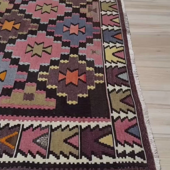 Multicolored vintage Caucasian kilim runner in charcoal plum with stepped diamond geometric design and Nazar motif, handwoven wool flatweave rug, approx. 5x9.