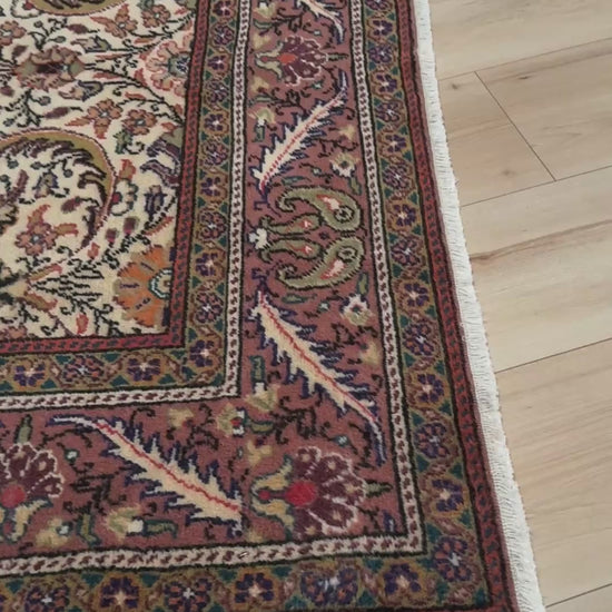 Vintage floral Kayseri handmade Turkish wool rug with an ivory field and scrolling botanical motifs in terracotta, soft rose, olive green, lavender, and ink blue. Size 5x7 ft. One-of-a-kind rug from Indigo Rugs in Burlingame, the best rug shop in the San Francisco Bay Area. Free shipping included.