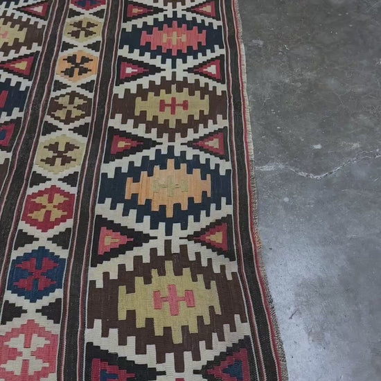 Vintage Caucasian Kazak tribal kilim rug with geometric medallions in beige, red, blue, and brown — handmade flatweave 5x8