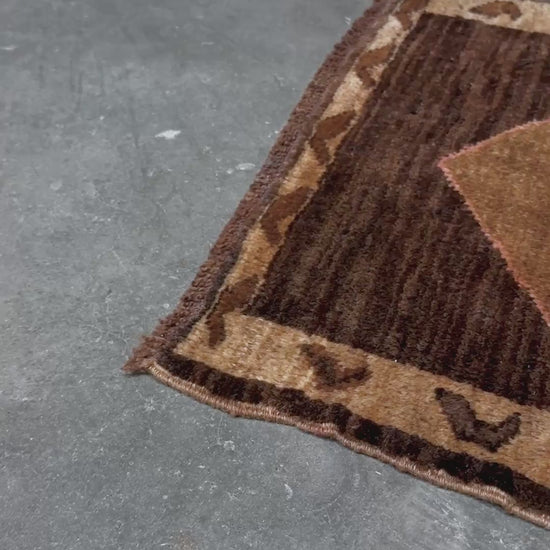 Decorative neutral vintage Turkish mini rug yastik 2x3 made from undyed handspun sheep wool, featuring natural brown and ivory tones with a subtle red accent, geometric medallion design. From Indigo Rugs, Burlingame — the best rug shop in the San Francisco Bay Area. Free shipping.