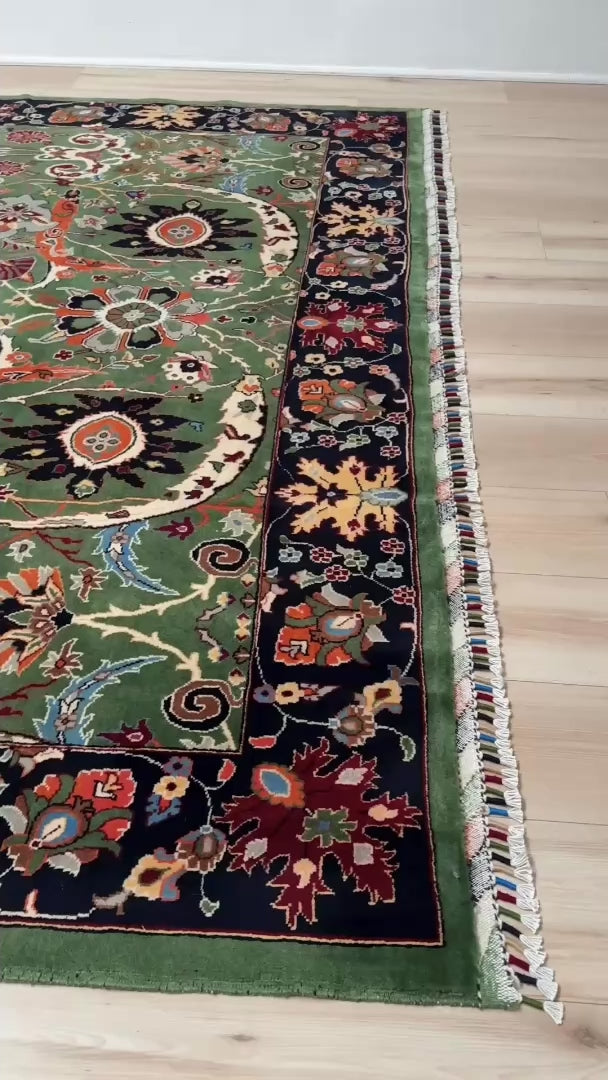 Brand new 9x12 Persian sickle leaf rug with verdant green, navy, and crimson hues, available at the best rug shop in San Mateo, SF Bay Area. Handwoven with intricate floral and vine patterns, perfect for a bedroom, living room, or dining space. High-quality wool rug with rich character and timeless elegance. Free shipping available.