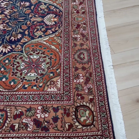 5x7 Navy Kayseri Turkish rug with peach medallion, floral vines, handmade wool from Indigo Rugs Burlingame Bay Area.