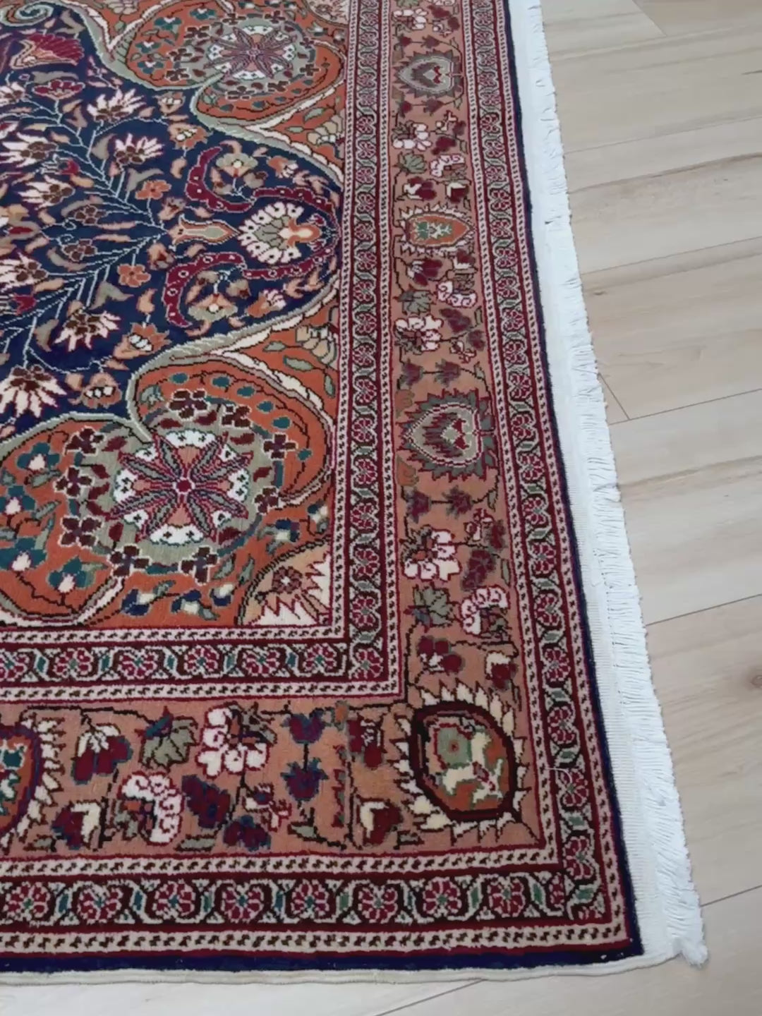 5x7 Navy Kayseri Turkish rug with peach medallion, floral vines, handmade wool from Indigo Rugs Burlingame Bay Area.