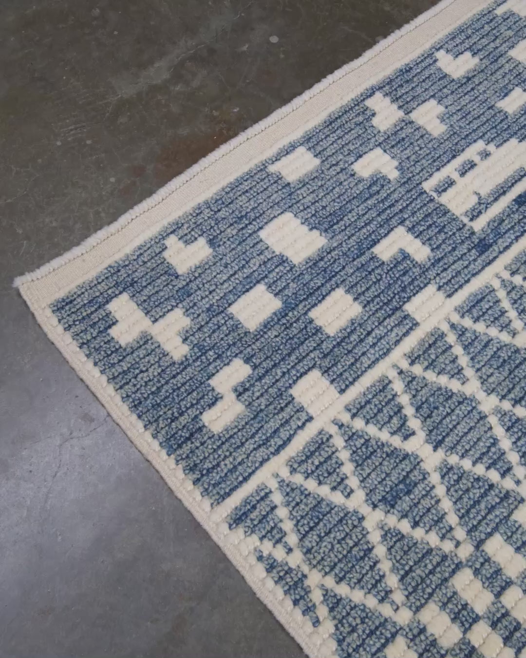 Small blue Turkish Tulu rug with ivory geometric motifs, checker details and textured wool pile, handmade wool rug 4x6 from Indigo Rugs Burlingame Bay Area.
