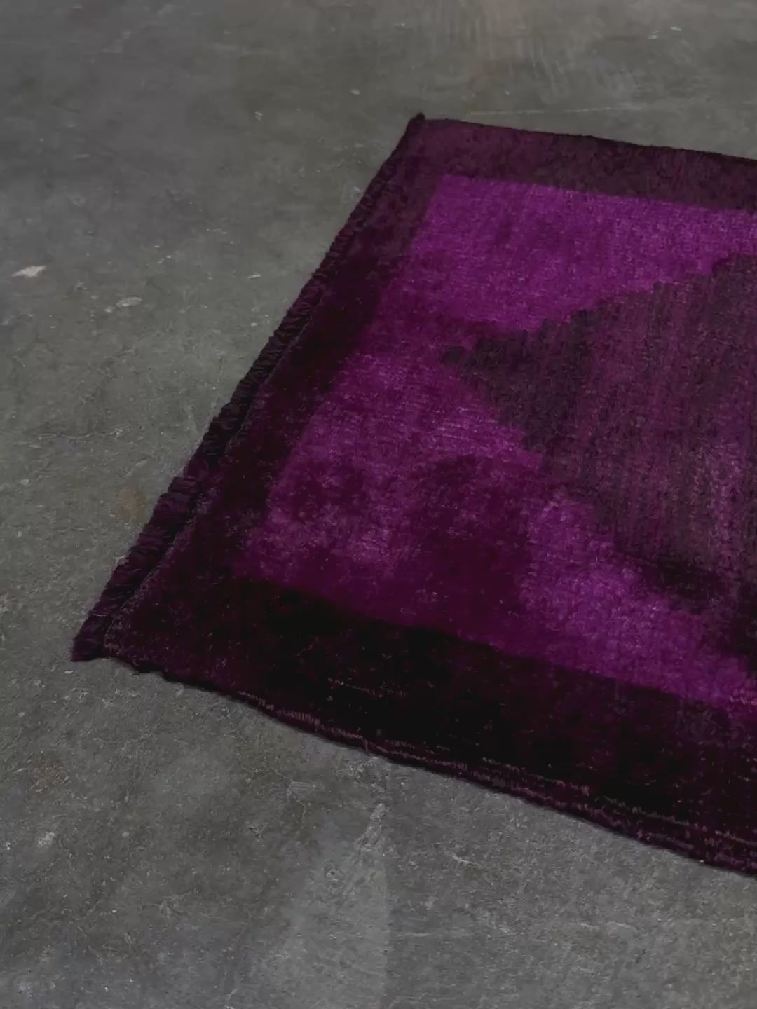 Magenta Purple Turkish mini rug with deep plum purple field, aubergine and blackberry shading, soft magenta border glow, and subtle geometric medallion. Handmade wool rug measuring 18 × 38 inches, perfect for entryways, kitchens, bedside spaces, or layered interiors.