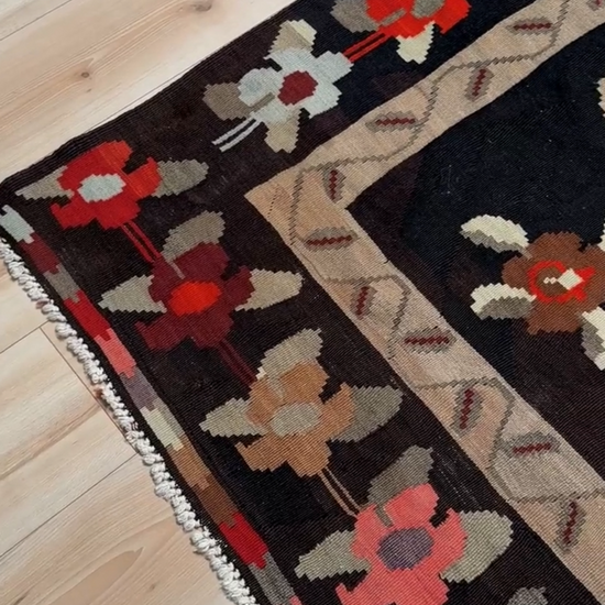 Handmade vintage Karabagh kilim wide runner rug, approx. 6x12, with dark chocolate brown field and large floral motifs in crimson, rose, ivory, and olive tones.