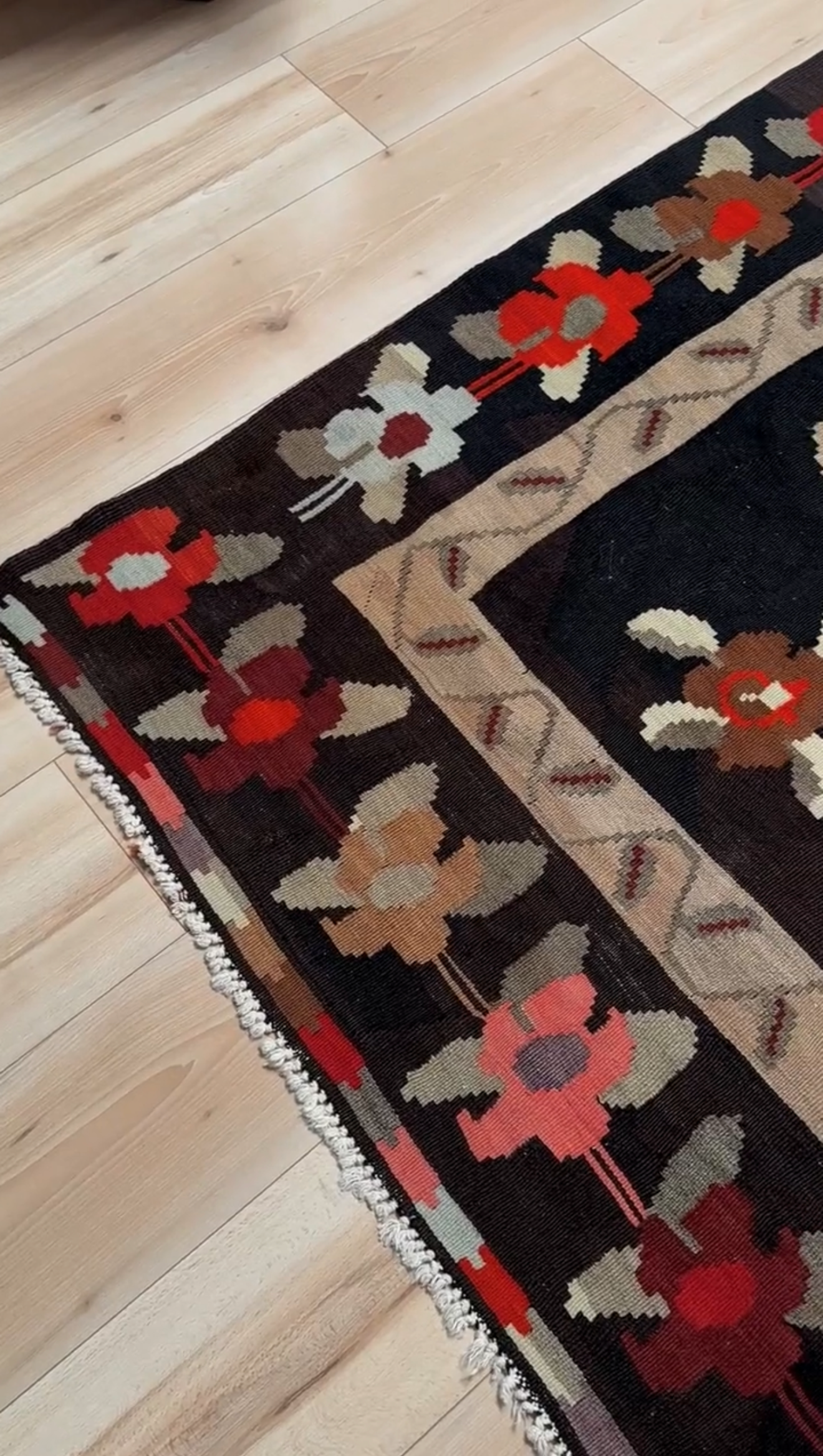 Handmade vintage Karabagh kilim wide runner rug, approx. 6x12, with dark chocolate brown field and large floral motifs in crimson, rose, ivory, and olive tones.