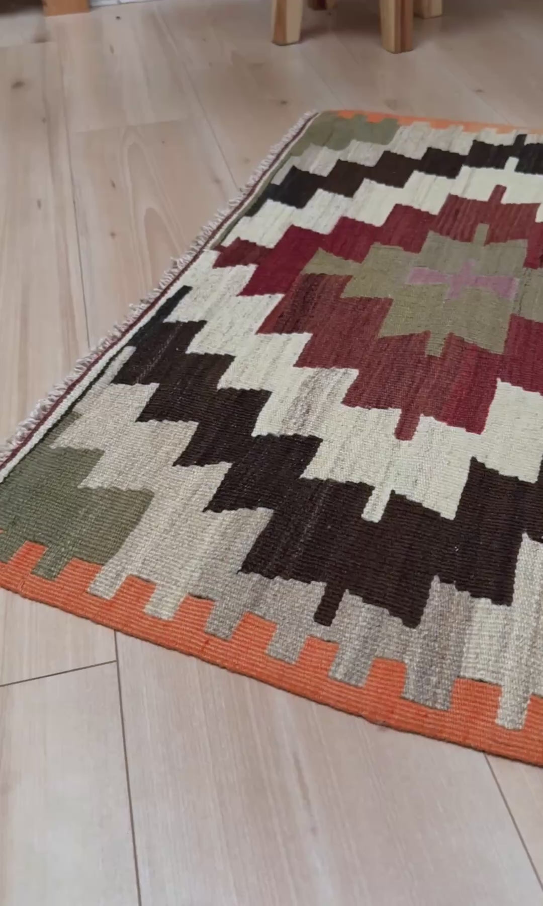 Navajo-style Mut Turkish kilim rug in earthy red, olive green, ivory, and charcoal tones, handwoven wool flatweave with bold geometric medallions, vintage tribal accent rug 2x5 for living room, bedroom, or entryway.