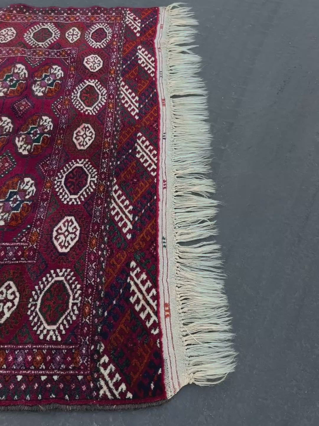 Vintage Turkmen Burgundy Bukhara rug 4x6 with repeating ivory gul motifs, velvety wool pile and classic tribal border. Hand-knotted wool decorative scatter rug for living room bedroom office from Indigo Rugs, Burlingame — the best rug shop in the San Francisco Bay Area. Free shipping.