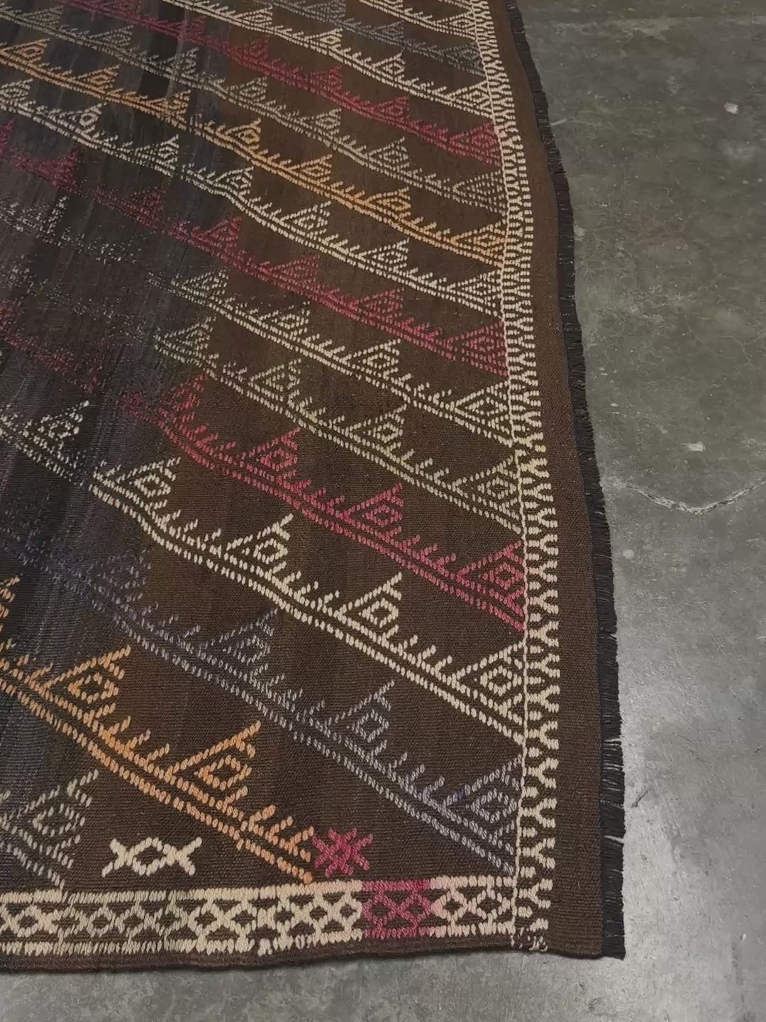 Earthy Vintage distressed Konya cicim kilim rug 6x8 with espresso-brown field, tribal embroidered motifs, and earthy tones — handmade Turkish flatweave carpet