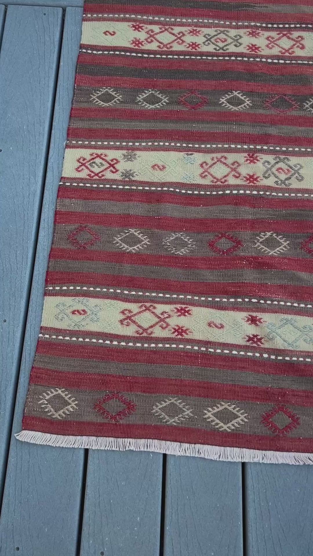 3x6 vintage turkish striped kilim rug with red, white, and black geometric pattern