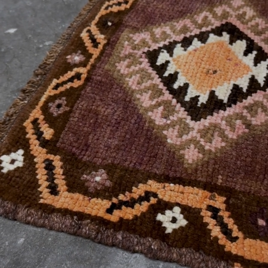 Earthy mauve and brown vintage Turkish mini rug with stacked diamond medallions in peach and ivory, handmade Anatolian Yastik rug 2x3, perfect for entryway or bedside accent, kitchen.