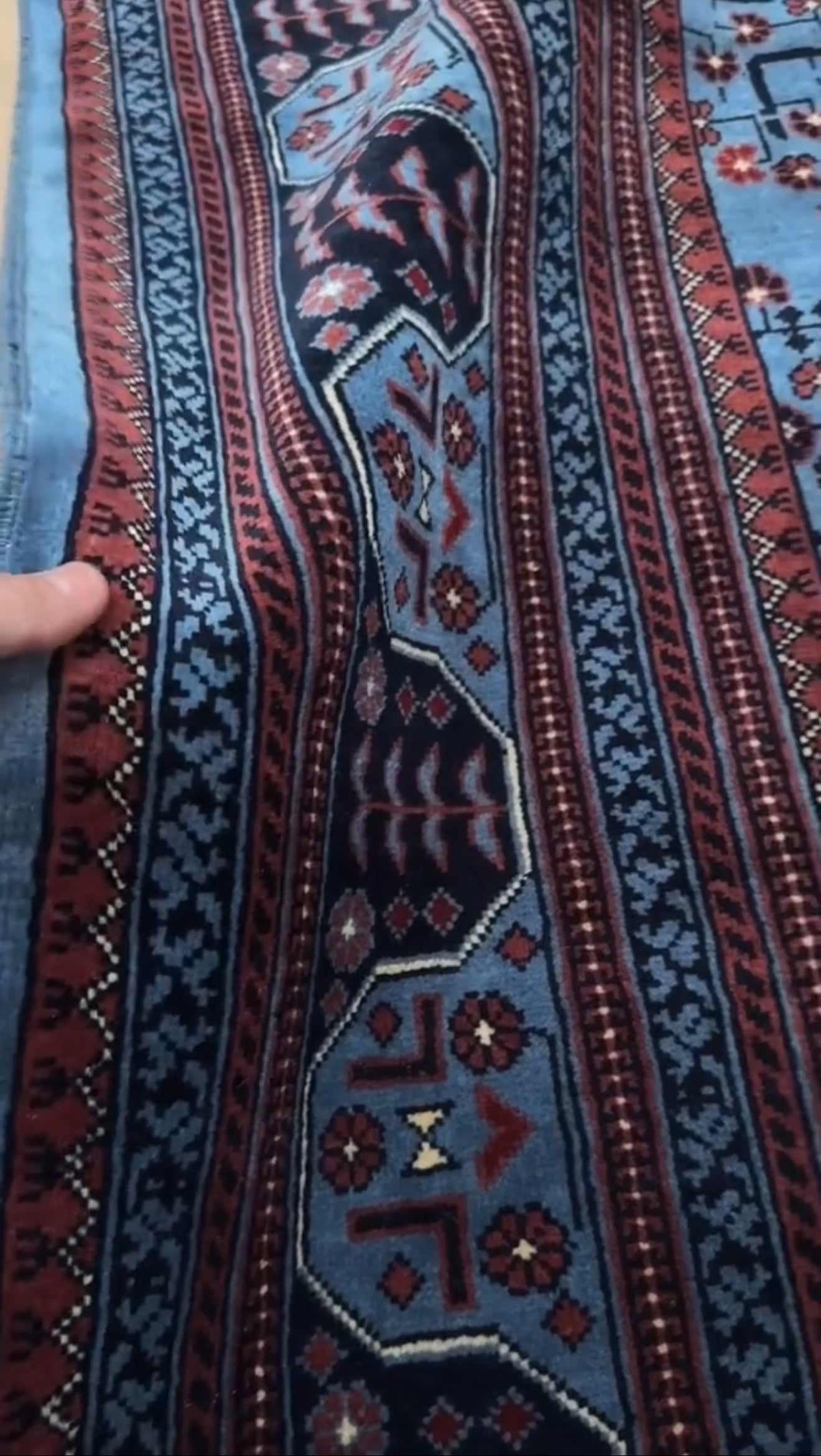 9x12 Handmade Turkmen rug with a baby blue ground, featuring traditional geometric motifs in brown, midnight blue, terracotta crafted from silky Merino wool with a luxurious sheen, available with free shipping from the best handmade rug shop Burlingame CA San Francisco Bay Area.