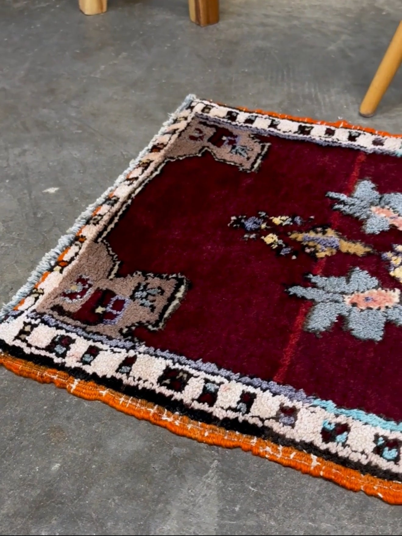 Vintage Turkish Yastik mini rug in ruby red. Hand-knotted wool, 20x33. One-of-a-kind rug from Indigo Rugs, the best rug shop in the San Francisco Bay Area (Burlingame, CA). Free shipping included.