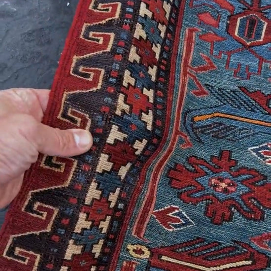 Antique Caucasian Soumak rug with madder red and indigo blue geometric medallions, woven in the South Caucasus circa 1925, available at top-rated rug shop in San Mateo, SF Bay Area with free shipping.