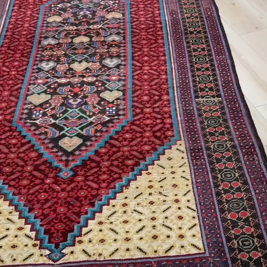 Handmade 5x9 vintage Persian rug with rich crimson, anthracite, and ivory hues, intricate geometric design, and a low pile full of character. Perfect for the bedroom, kitchen, living room, or dining area. Available at the best rug shop in San Mateo, SF Bay Area, with free shipping.