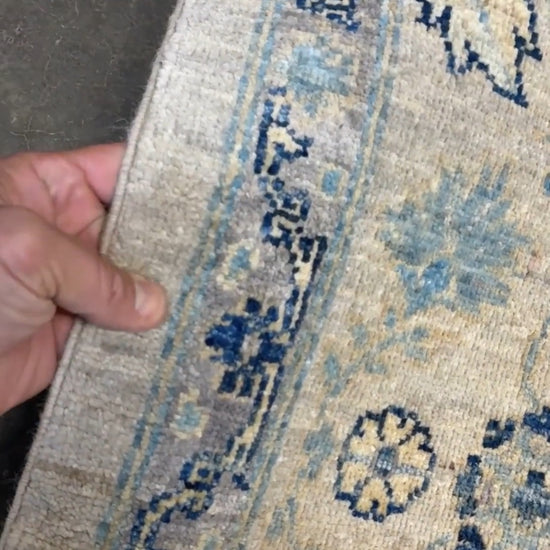 Neutral transitional handmade 8x10 decorative rug with muted gray, ivory, and layered blue tones. Soft Sultanabad-inspired floral motifs, perfect for living rooms, dining spaces, or bedrooms. Contemporary yet timeless, from a rug shop in Burlingame, San Francisco Bay Area, CA with free shipping.