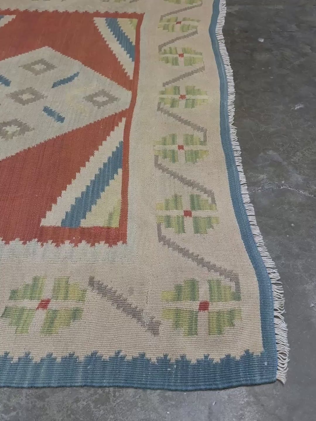 Vintage Turkish Malatya kilim rug with coral red field and diamond medallions, handwoven Anatolian flatweave 5x8 geometric wool rug