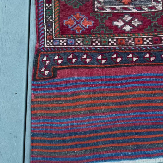 Vintage Bakhtiari Khorjin saddle bag rug 2x6 — 1940s Persian tribal runner handwoven with flatweave, pile, and soumak techniques in crimson, indigo, orange, and ivory — antique wool rug from Northwest Persia, Indigo Rugs Burlingame CA.