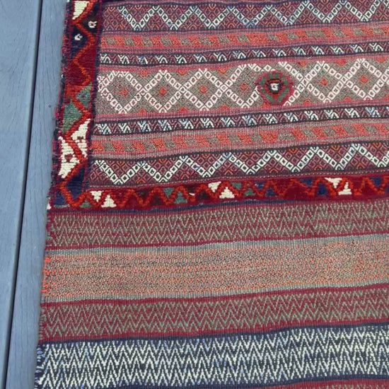 Vintage Bakhtiari khorjin saddle bag wall art rug (3'x6'7") featuring terracotta and ivory diamond motifs, olive and charcoal tribal patterns, and rare triple-weave structure — handmade in NW Persia, circa 1940s