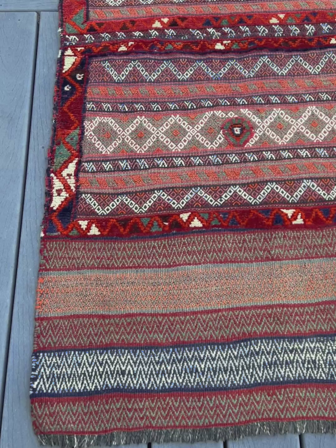 Vintage Bakhtiari khorjin saddle bag wall art rug (3'x6'7") featuring terracotta and ivory diamond motifs, olive and charcoal tribal patterns, and rare triple-weave structure — handmade in NW Persia, circa 1940s