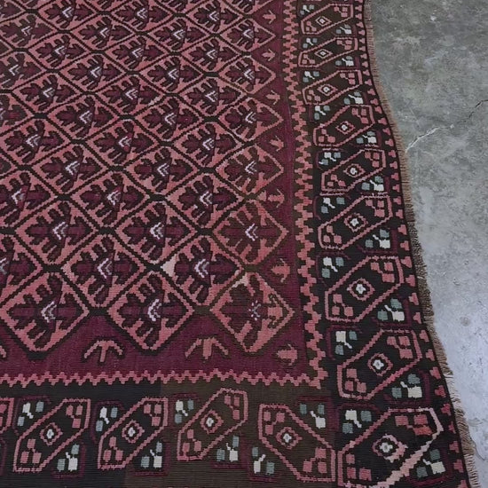 Vintage Caucasian kilim rug with wine red and dusty rose lattice field and tribal animal motifs, handwoven wool flatweave 5x10 runner size from Indigo Rugs Burlingame California