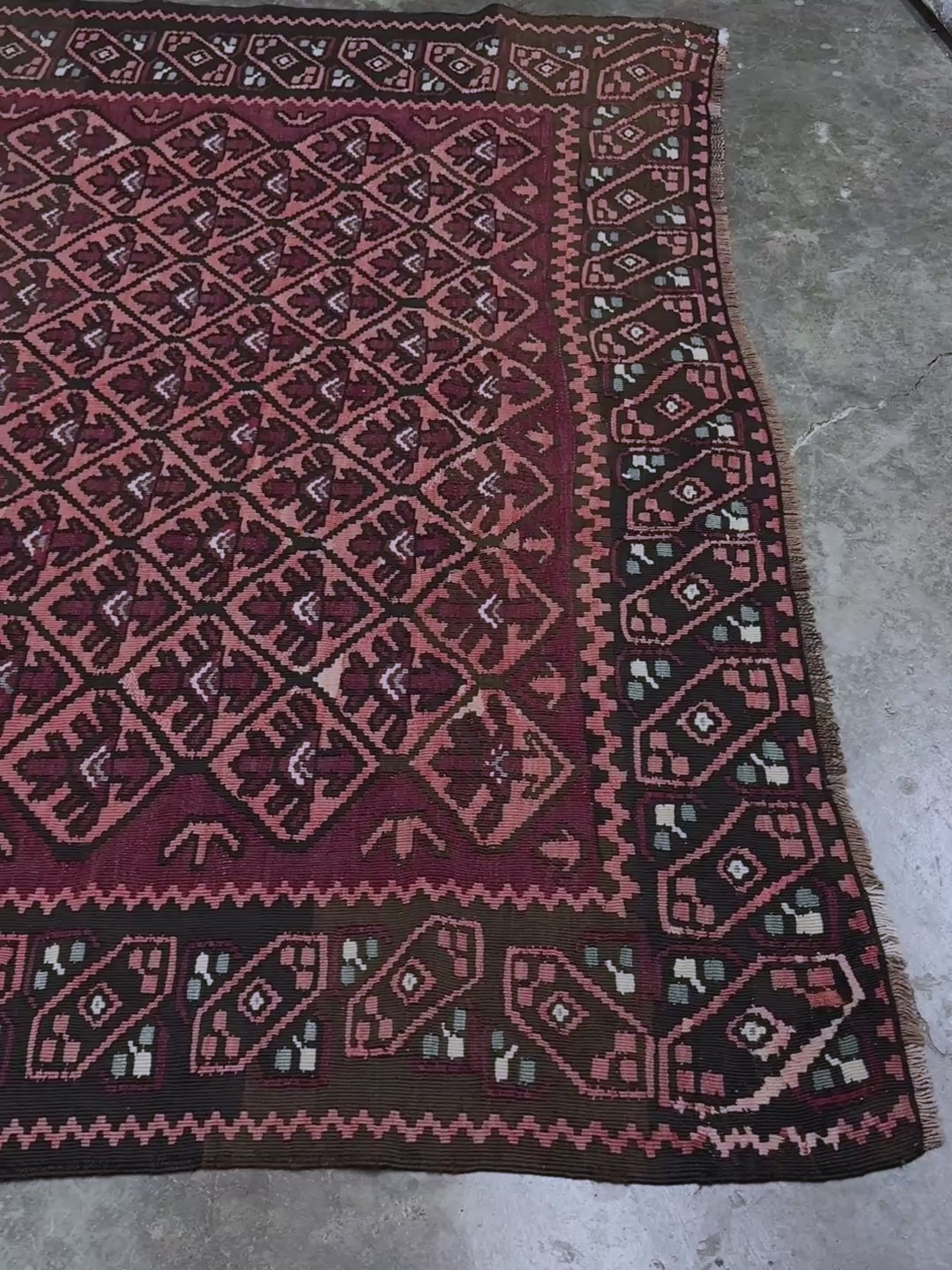 Vintage Caucasian kilim rug with wine red and dusty rose lattice field and tribal animal motifs, handwoven wool flatweave 5x10 runner size from Indigo Rugs Burlingame California