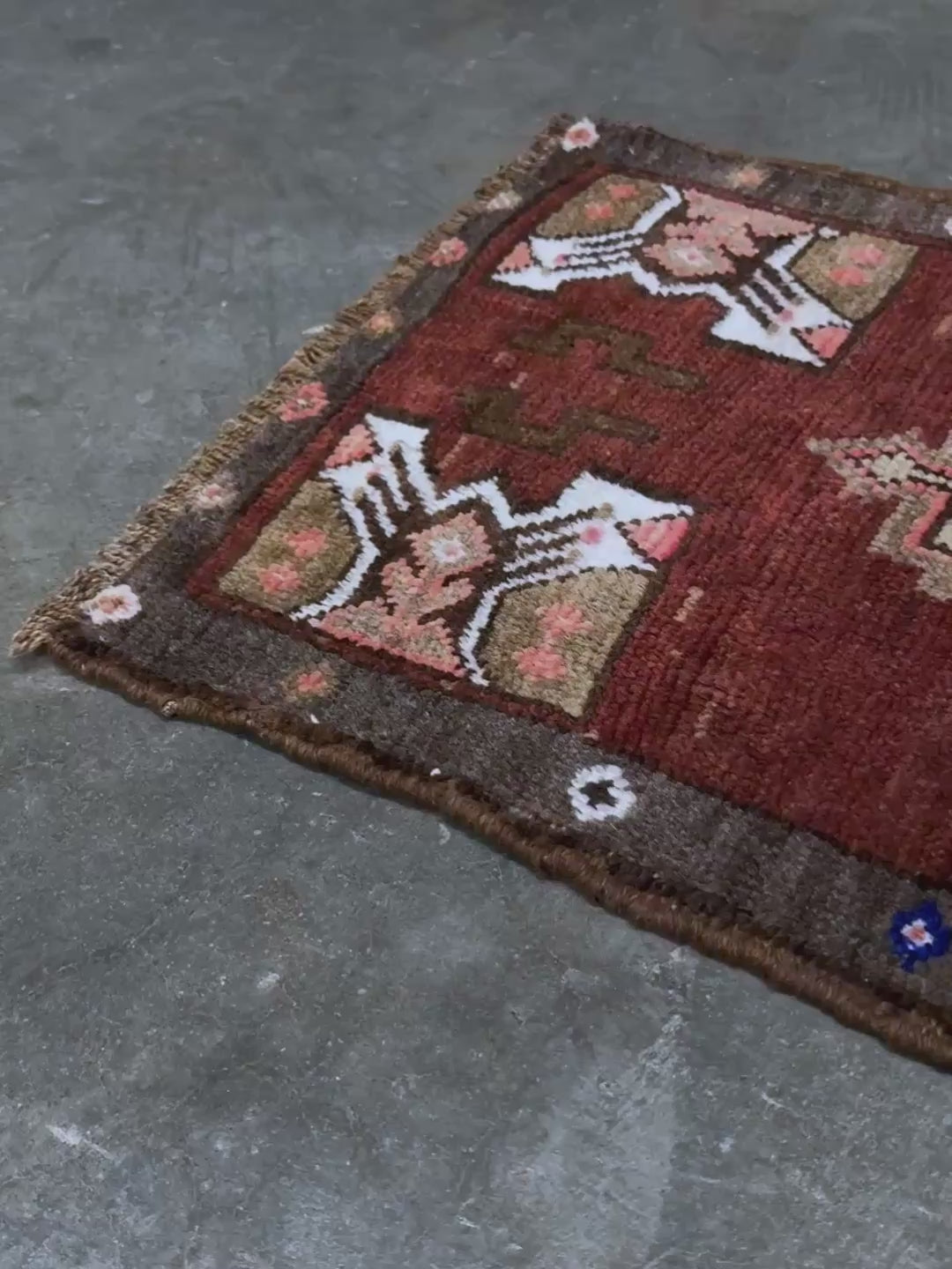 Vintage Turkish Yastik mini rug in chestnut brown with espresso outlines, camel-brown medallion, ivory highlights, muted blush and turquoise floral accents. Hand-knotted wool, 19x37 inches. One-of-a-kind vintage piece from the best rug shop in the San Francisco Bay Area, Indigo Rugs in Burlingame, CA. Free shipping included.