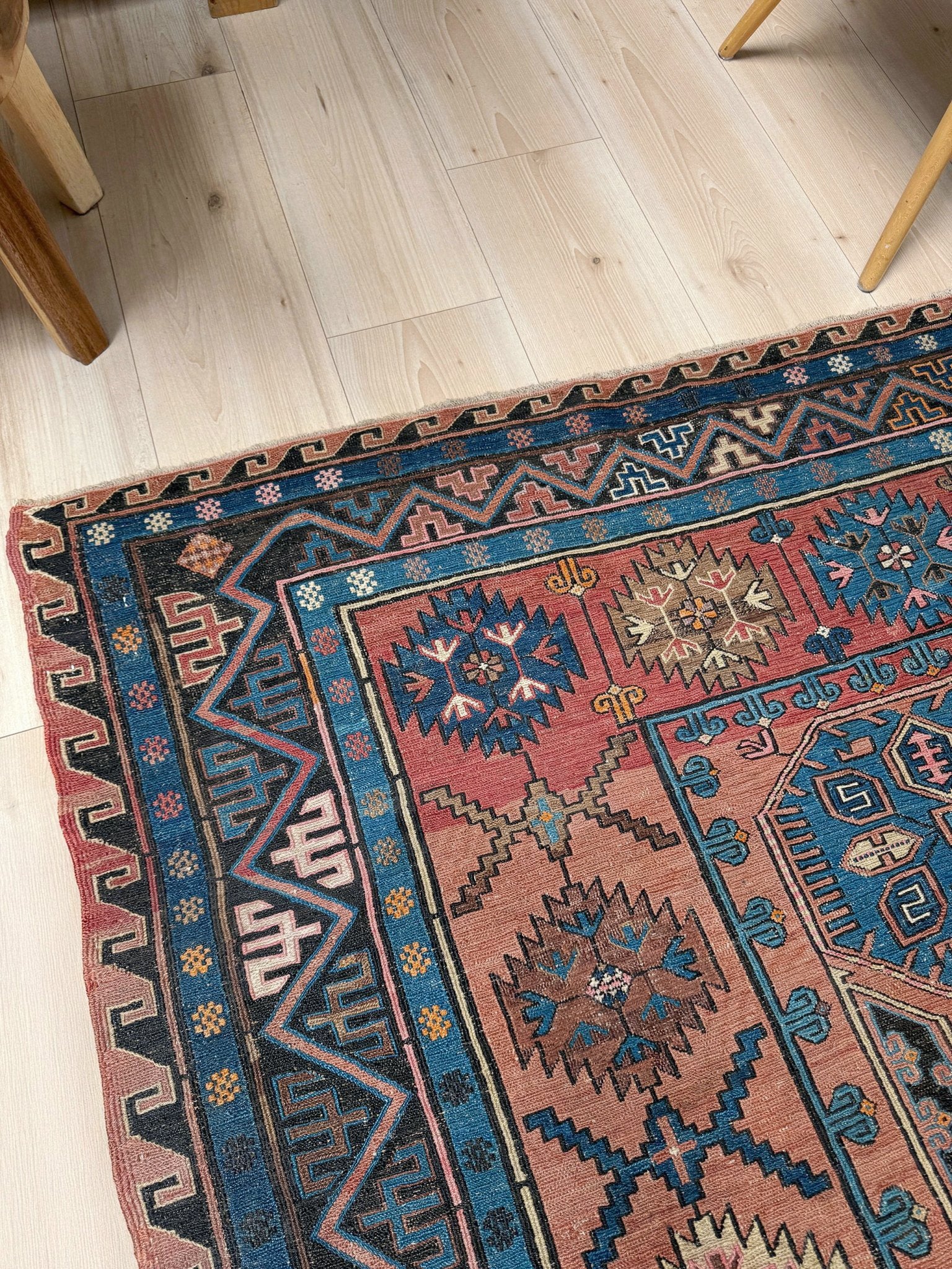 Late 19th century antique Konagkend Soumak rug from Kuba, Caucasus – 7x10 tribal flatweave with indigo, terracotta, and copper brown tones, available at the best rug shop in San Mateo, SF Bay Area with free shipping.