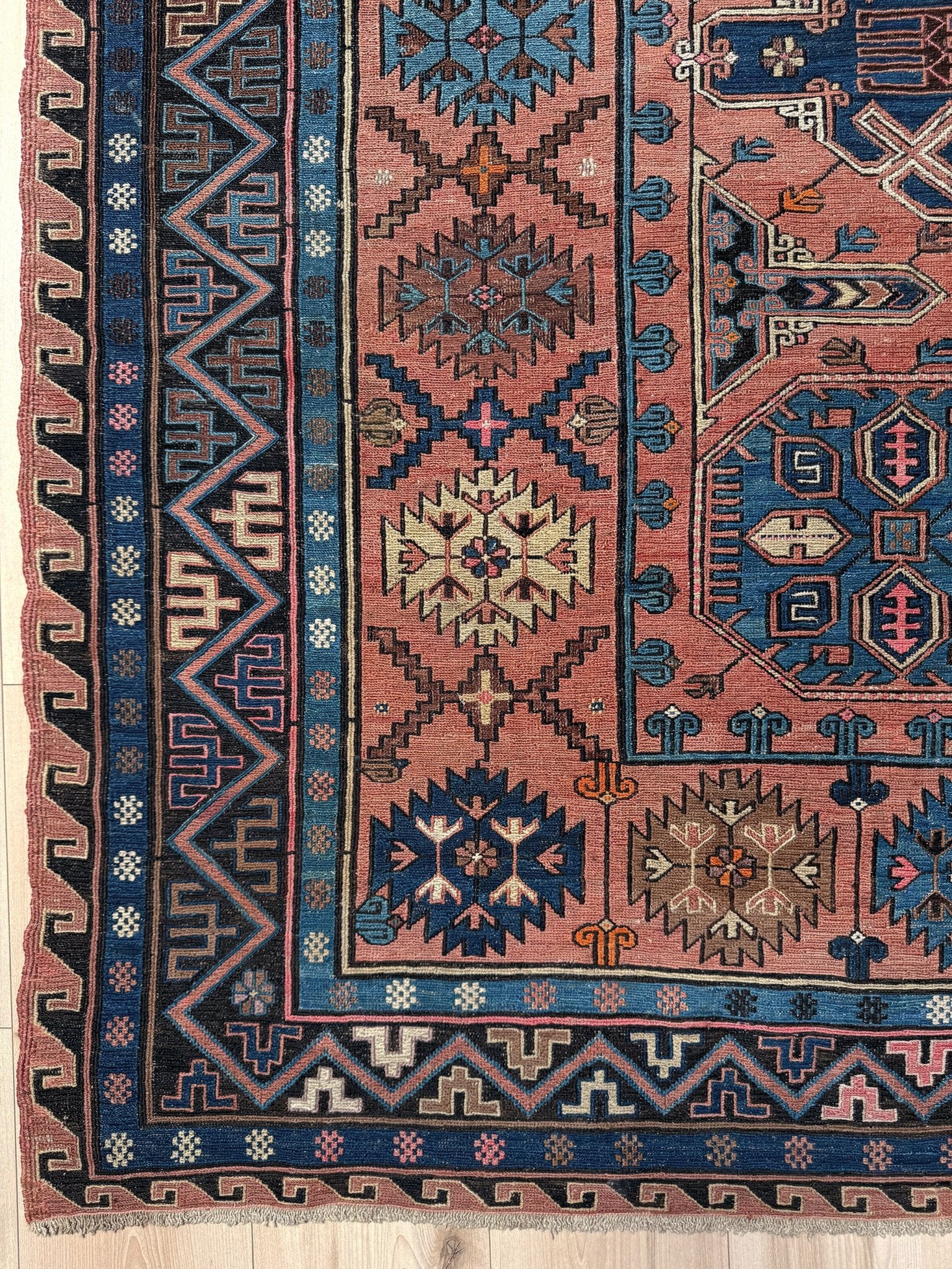 Late 19th century antique Konagkend Soumak rug from Kuba, Caucasus – 7x10 tribal flatweave with indigo, terracotta, and copper brown tones, available at the best rug shop in San Mateo, SF Bay Area with free shipping.