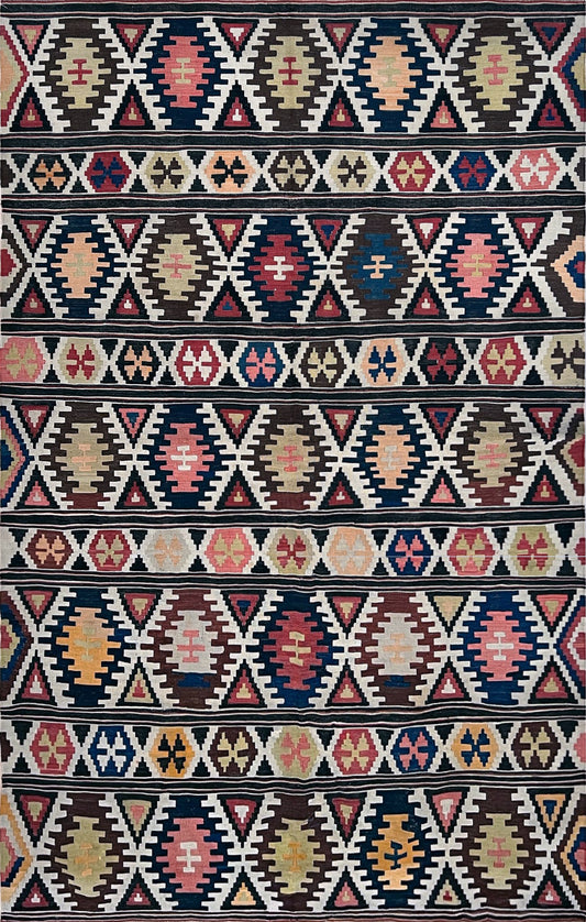 5x8 Kazak caucasian tribal kilim rug with vibrant rug. Handmade in living room setting. Flatweave rug shop Bay Area SF, California.  Wool rug for nursery Bright colors, bold color, rug store, rug shop  Palo Alto, berkeley, vintage rug, modern kilim, warm colors, antique rug.