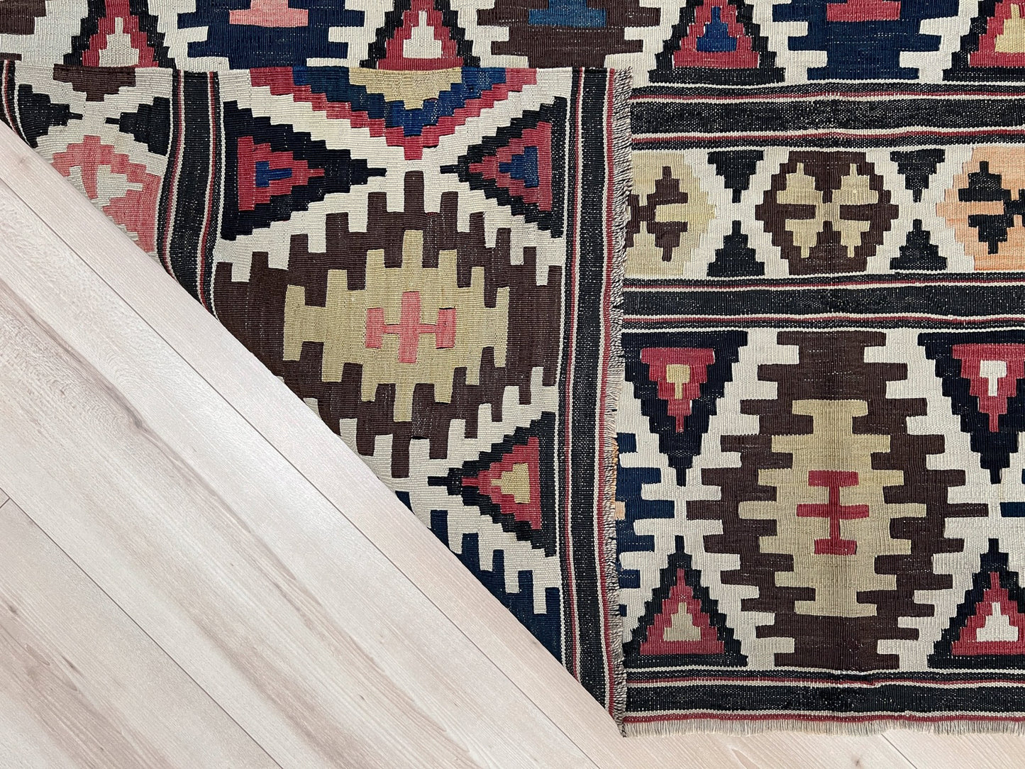 Vintage Caucasian Kazak tribal kilim rug with geometric medallions in beige, red, blue, and brown — handmade flatweave 5x8