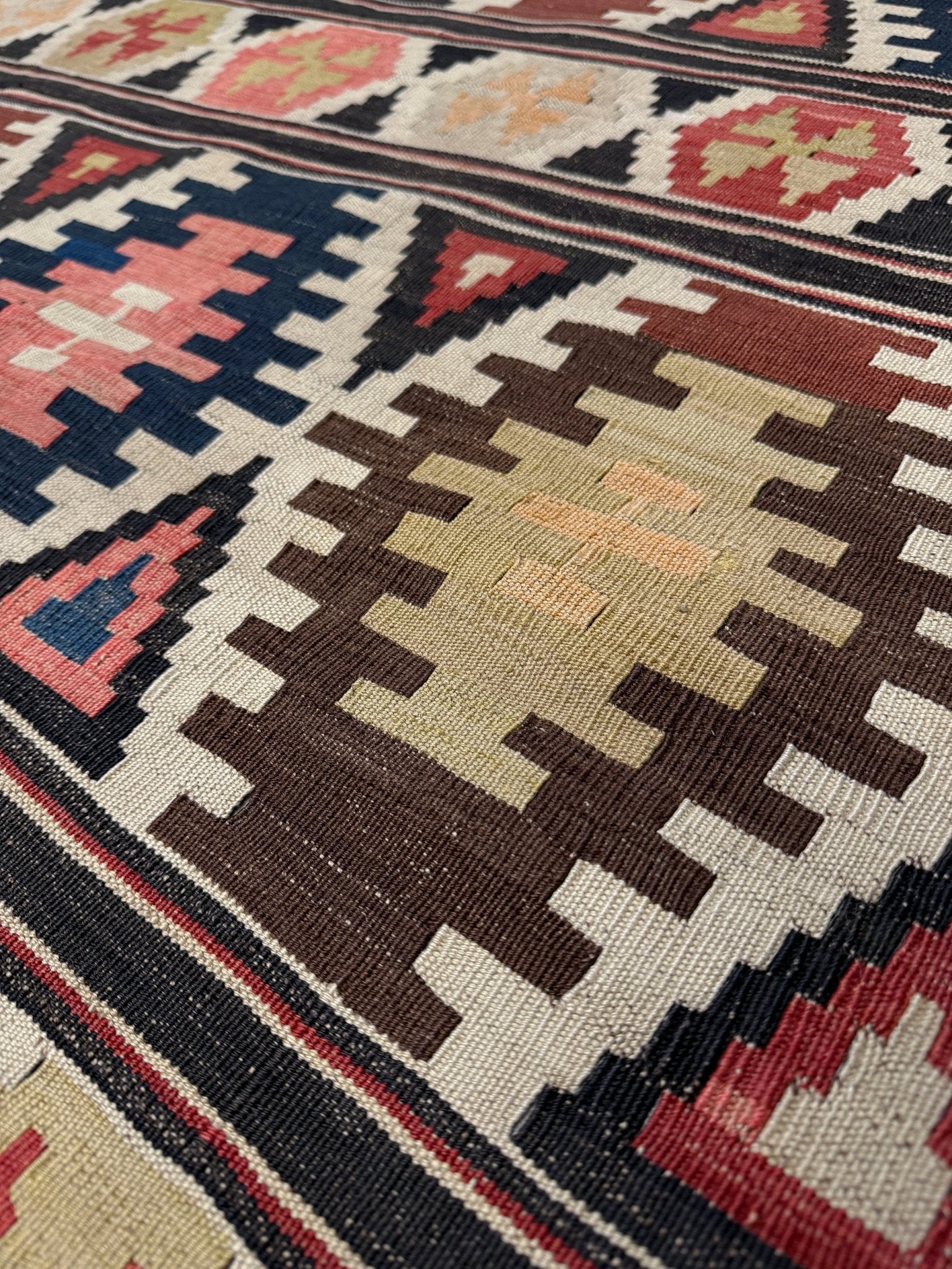 Vintage Caucasian Kazak tribal kilim rug with geometric medallions in beige, red, blue, and brown — handmade flatweave 5x8