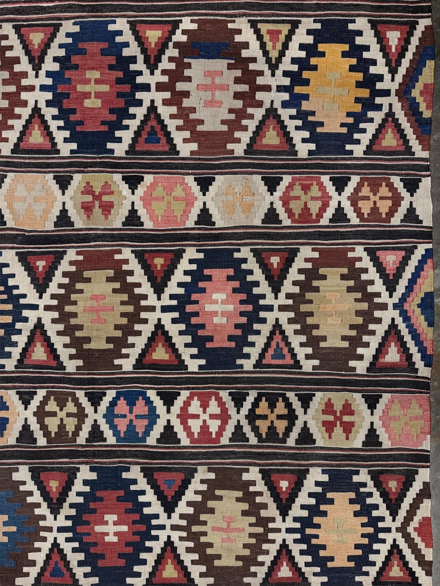 Vintage Caucasian Kazak tribal kilim rug with geometric medallions in beige, red, blue, and brown — handmade flatweave 5x8