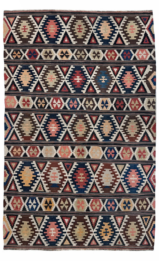 Traditional patterned rug with geometric design. Vintage Caucasian Kazak tribal kilim rug with geometric medallions in beige, red, blue, and brown — handmade flatweave 5x8