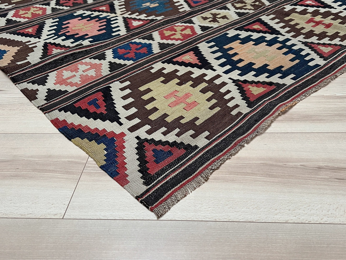 Vintage Caucasian Kazak tribal kilim rug with geometric medallions in beige, red, blue, and brown — handmade flatweave 5x8
