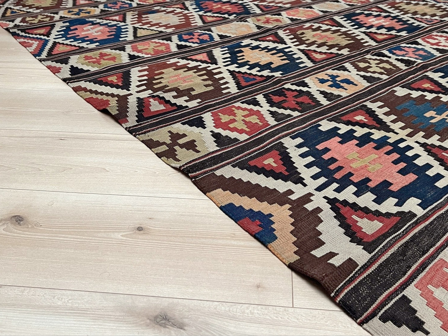 Vintage Caucasian Kazak tribal kilim rug with geometric medallions in beige, red, blue, and brown — handmade flatweave 5x8