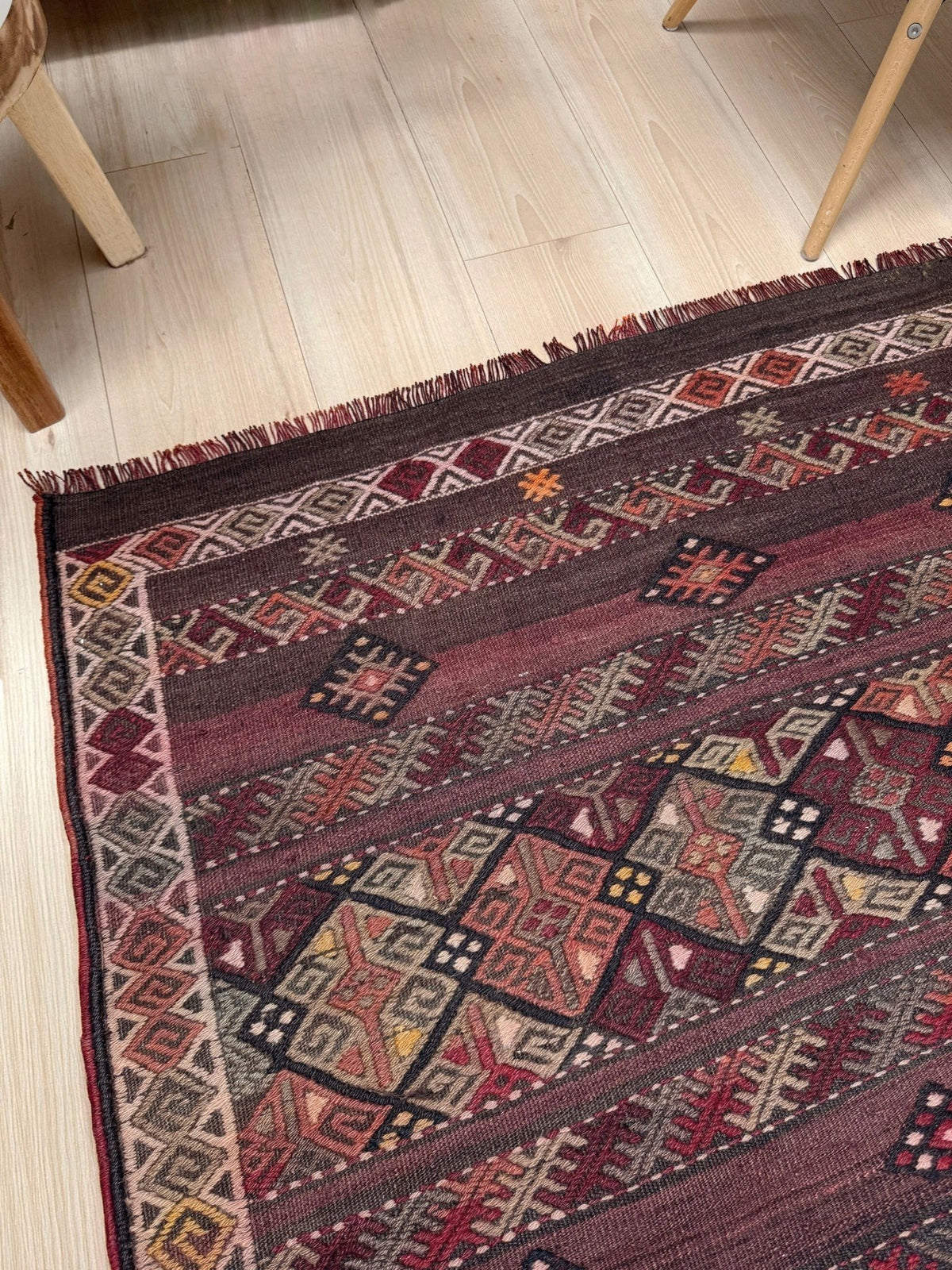 Traditional patterned rug with geometric design. 7x13 eggplant purple oxblood red Vintage 1940s Kurdish Kars kilim rug with tribal motifs for long living rooms, hallways, great rooms, and layered interiors. From Indigo Rugs, Burlingame CA.