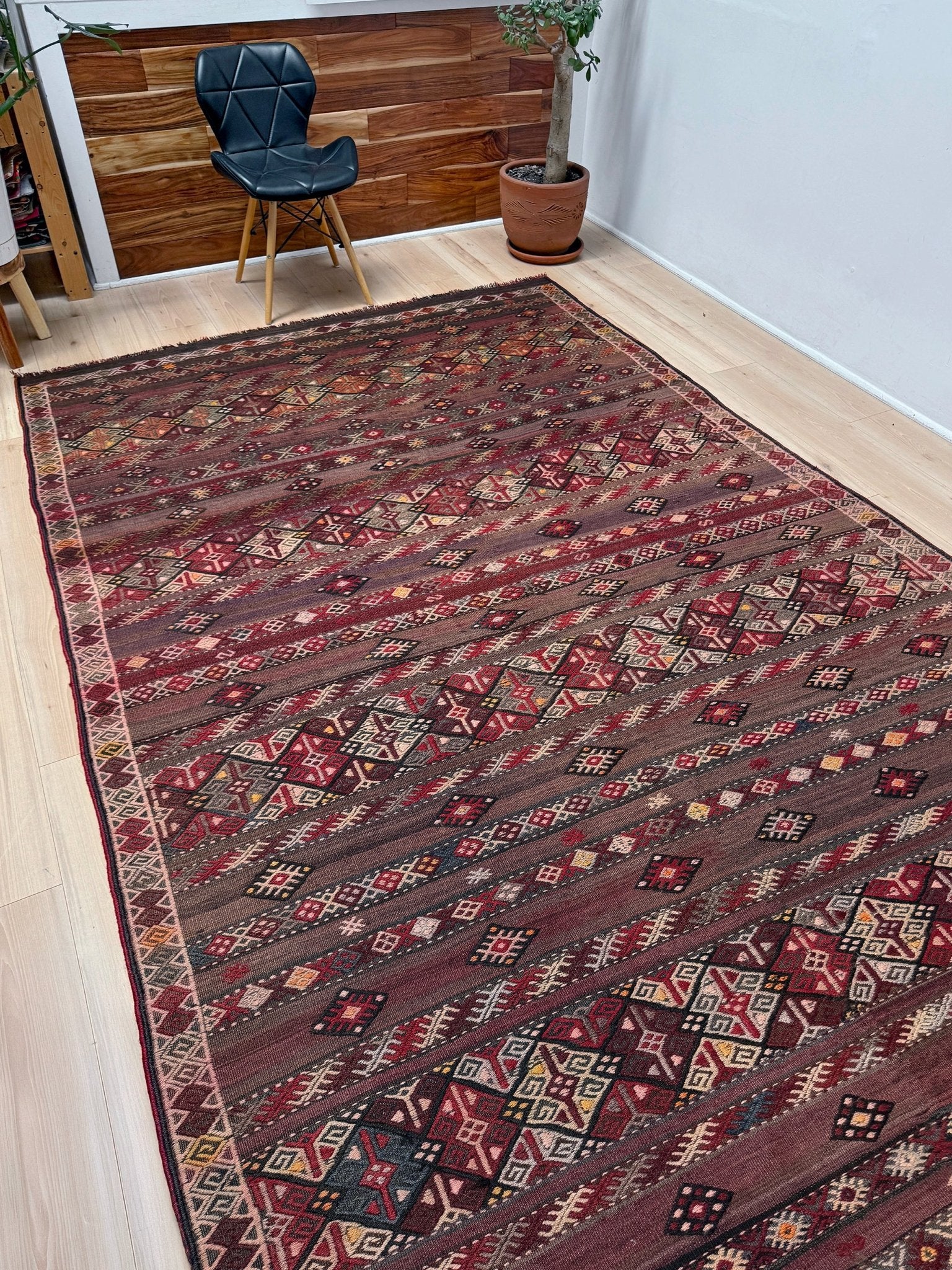 7x13 eggplant purple oxblood red Vintage 1940s Kurdish Kars kilim rug with tribal motifs. Handmade wool flatweave rug — perfect for long living rooms, hallways, great rooms, and layered interiors. From Indigo Rugs, Burlingame CA. Free shipping.