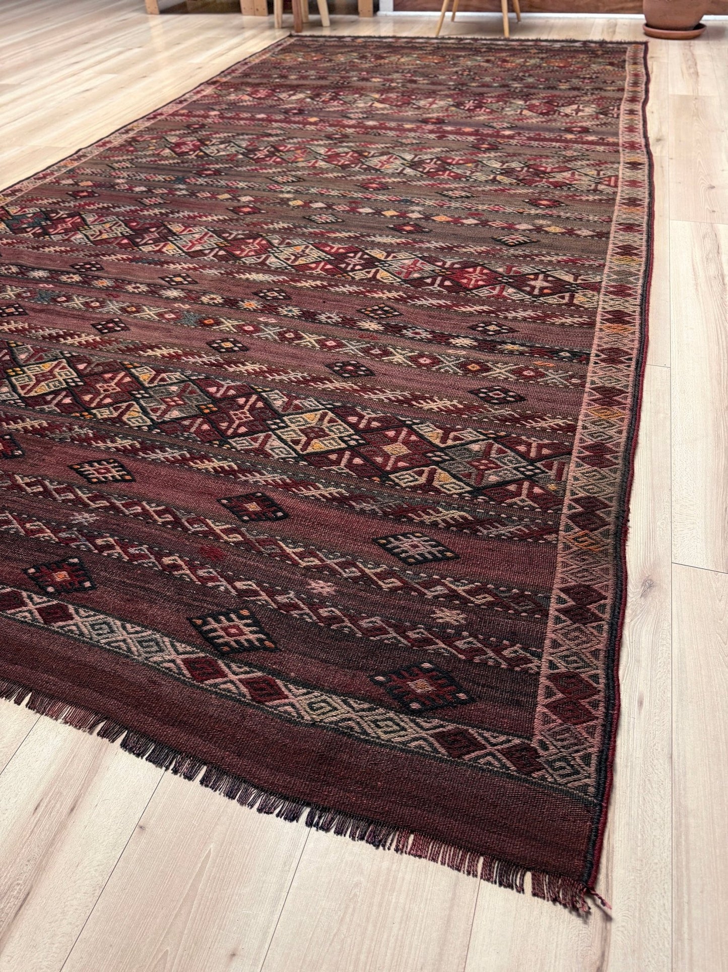 7x13 eggplant purple oxblood red Earthy  Vintage 1940s Kurdish Kars kilim rug with tribal motifs. Handmade wool flatweave rug — perfect for long living rooms, hallways, great rooms, and layered interiors. From Indigo Rugs, Burlingame CA. Free shipping.