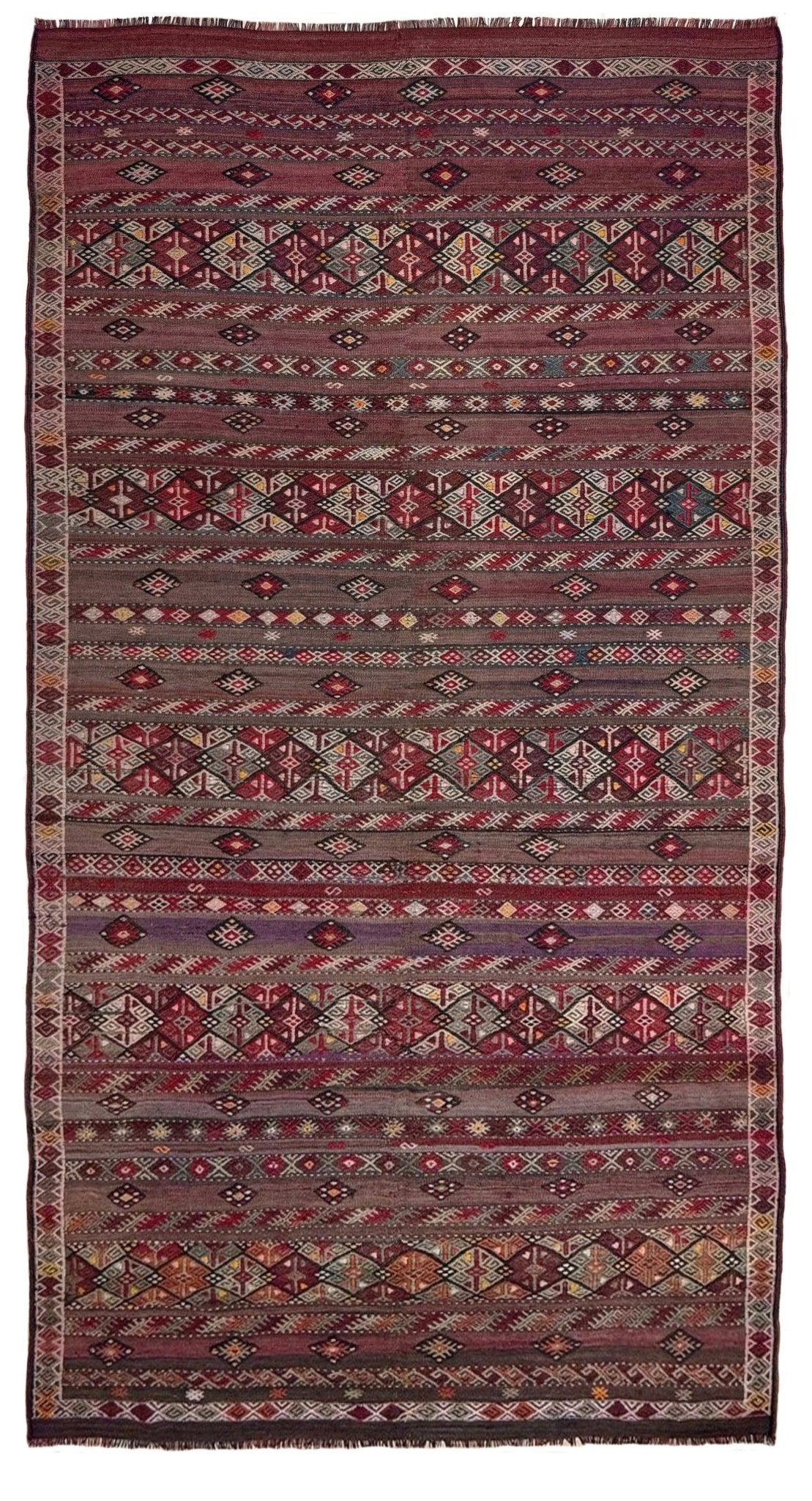 Traditional patterned rug with geometric design. 7x13 eggplant purple oxblood red Vintage 1940s Kurdish Kars kilim rug with tribal motifs for long living rooms, hallways, great rooms, and layered interiors. From Indigo Rugs, Burlingame CA.