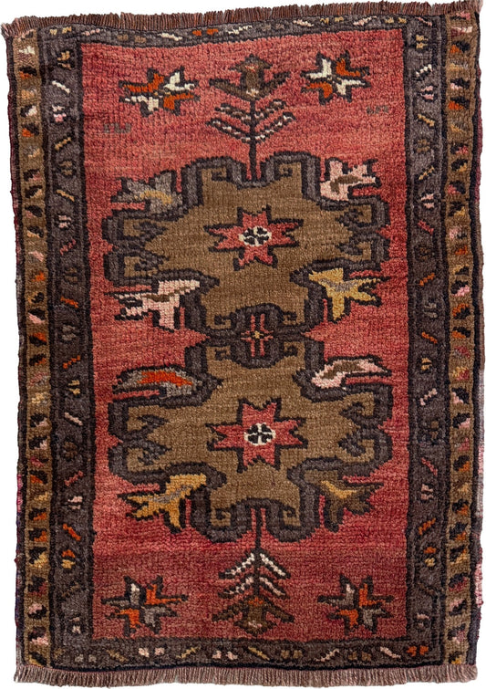Vintage Turkish Yastik rug with a terracotta field, olive-brown medallions. Hand-knotted wool, 24x34 inches. Perfect accent  mini rug kitchen, entry, bathroom, study.  One-of-a-kind rug from Indigo Rugs in Burlingame, the best rug shop in the San Francisco Bay Area. Free shipping included.