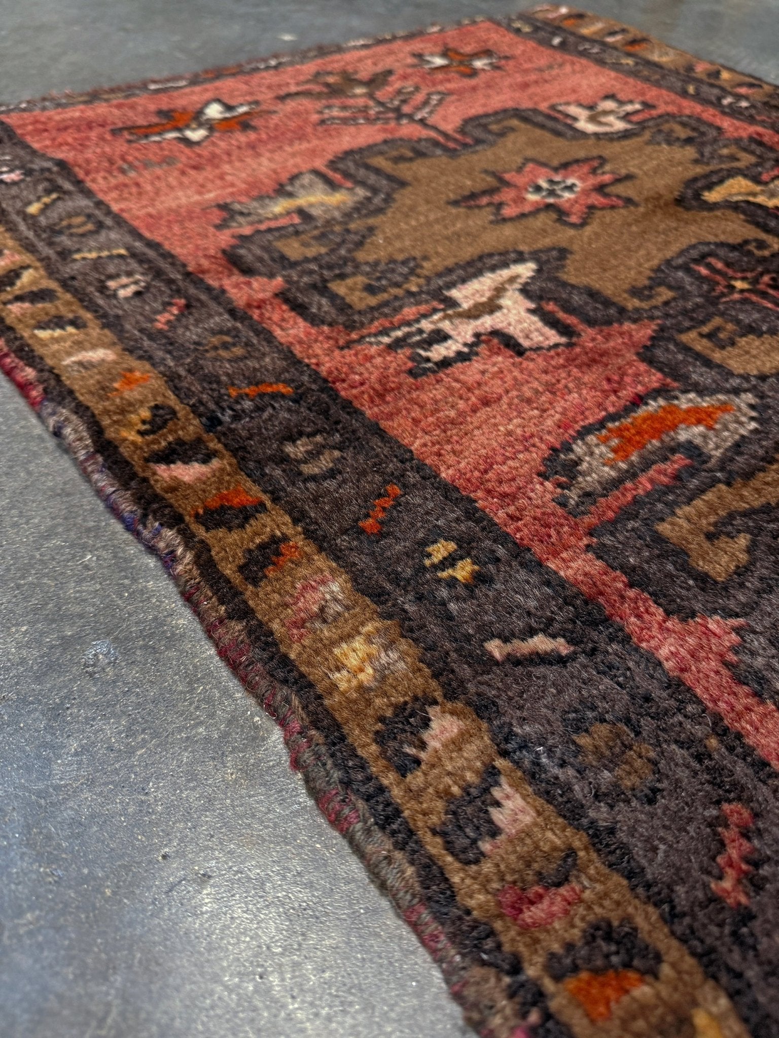 Vintage Turkish Yastik rug with a terracotta field, olive-brown medallions. Hand-knotted wool, 24x34 inches. Perfect accent  mini rug kitchen, entry, bathroom, study.  One-of-a-kind rug from Indigo Rugs in Burlingame, the best rug shop in the San Francisco Bay Area. Free shipping included.