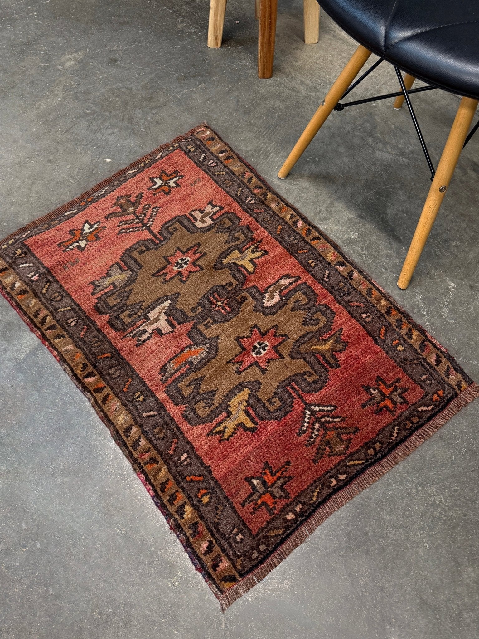 Vintage Turkish Yastik rug with a terracotta field, olive-brown medallions. Hand-knotted wool, 24x34 inches. Perfect accent  mini rug kitchen, entry, bathroom, study.  One-of-a-kind rug from Indigo Rugs in Burlingame, the best rug shop in the San Francisco Bay Area. Free shipping included.