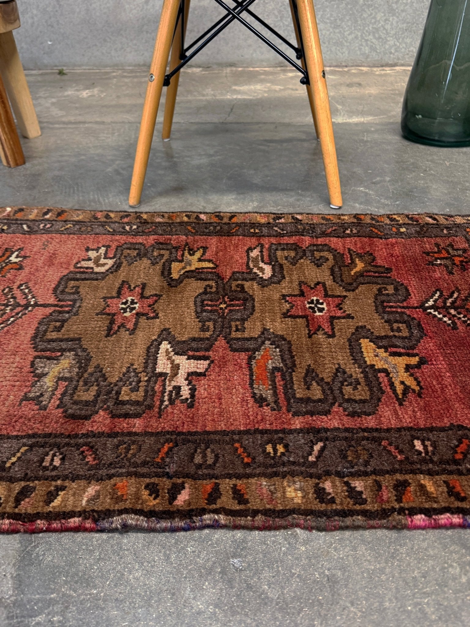 Vintage Turkish Yastik rug with a terracotta field, olive-brown medallions. Hand-knotted wool, 24x34 inches. Perfect accent  mini rug kitchen, entry, bathroom, study.  One-of-a-kind rug from Indigo Rugs in Burlingame, the best rug shop in the San Francisco Bay Area. Free shipping included.
