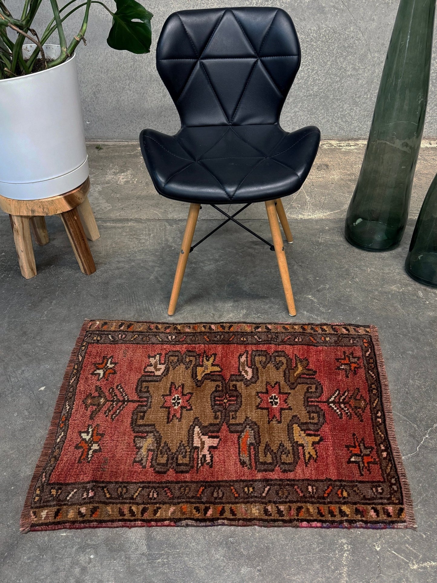 Vintage Turkish Yastik rug with a terracotta field, olive-brown medallions. Hand-knotted wool, 24x34 inches. Perfect accent  mini rug kitchen, entry, bathroom, study.  One-of-a-kind rug from Indigo Rugs in Burlingame, the best rug shop in the San Francisco Bay Area. Free shipping included.