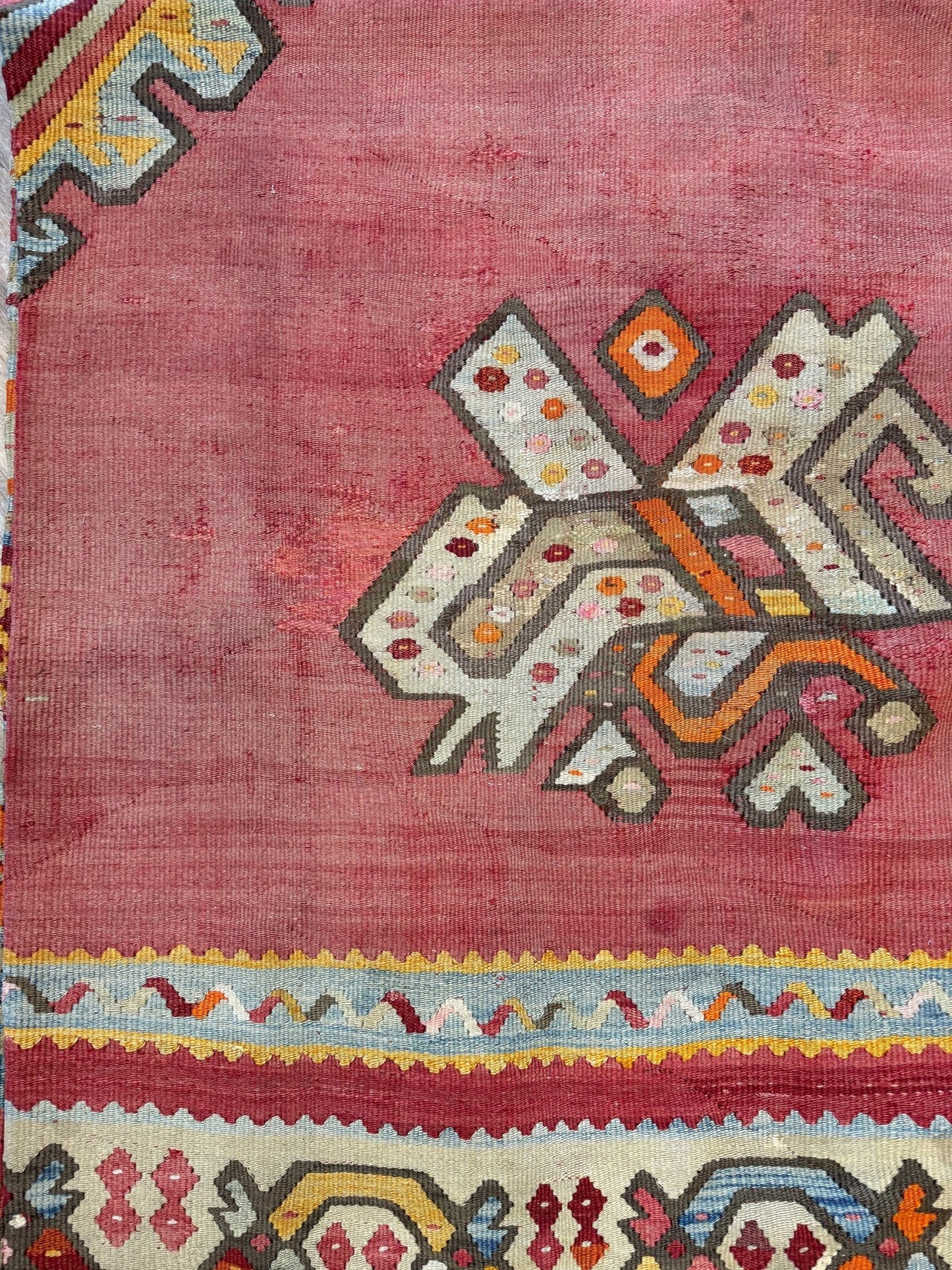 Muted brick red 1920s handmade Oushak Turkish kilim rug with red field and Elibelinde motif, perfect for boho or floral decor styles in living room, bedroom, kitchen, or dining room; available from top-rated rug shop in San Mateo, SF Bay Area with free shipping.