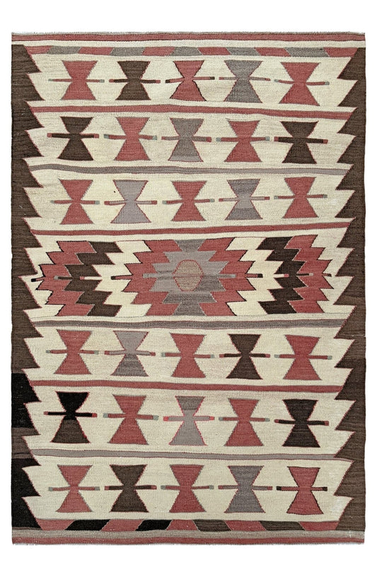 Woven rug with geometric pattern on a plain background. Vintage Mut kilim rug 3x5 with Navajo-style geometric medallions — handwoven Turkish wool flatweave, available at Indigo Rugs, the best rug shop in San Francisco Bay Area, Burlingame CA.