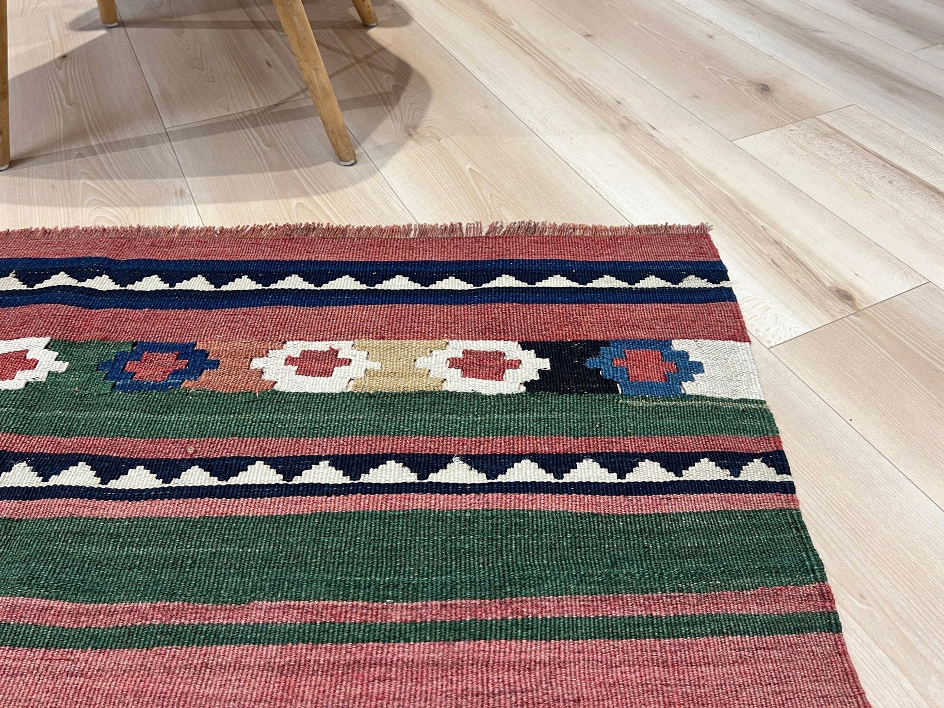 Vintage Caucasian Kilim flatweave rug with rose, green, and navy horizontal stripes and tribal motifs — handmade wool wall hanging from the 1960s, available at Indigo Rugs, the best rug shop in San Francisco Bay Area, Burlingame CA.